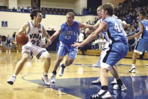 Men's basketball team captain Chris Leanza '03, left, looks for an open passing lane against Columbia this year at the John J. Lee Amphitheater. Leanza, like other members of the men's basketball team, is considering continuing his basketball career at the professional level in Europe next year.