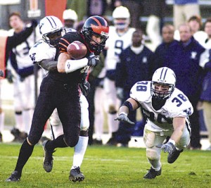 Two Yale defenders collapse on a Princeton player at Princeton Stadium Saturday. After a dismal 17-3 first half, the Eli defense finally came to life, shutting out the Tigers in the second frame. The Bulldogs triumphed 27-24 in double overtime off a 26-yard field goal by John Troost '05.