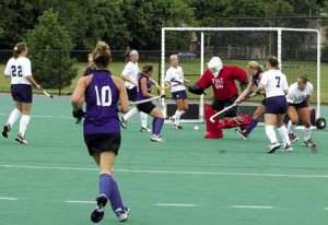 Yale goalie Kate Crandall ’06 (in red) prepares to kick the ball away from a Holy Cross forward Sept. 5. The Elis will face their first and arguably toughest trial of the season, Princeton, this Saturday at Johnson Field. In the teams’ last meeting, the Bulldogs took the Tigers into overtime before falling 5-4.