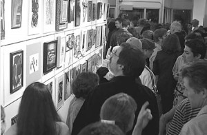 Yale students, New Haven residents, artists and art collectors crowd the opening event of the City-Wide Open Studios Friday on Orange Street. Now in its seventh year, Open Studios will display works from about 500 different local artists in a variety of media over the next three weeks.