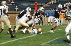 Eli tailback Robert Carr ’05 drags two Lehigh defenders with him as he punches into the end zone for one of his two second-quarter rushing touchdowns in Saturday’s 30-24 loss to the Mountain Hawks. Yale dominated early, but Lehigh’s three second-half touchdowns helped erase a first-half Bulldogs lead.