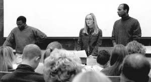 Marcus Haymon ’05 (left), Caroline Edsall ’06 (center) and Simba Marekera ’07 (right), organizers of Yale’s Colleges Against Cancer chapter, reach out to students at a kick-off rally in Harkness Auditorium. This year the group will focus on the Relay for Life, an event to be held at the University track.