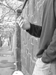A student takes a drag of a cigarette. Smoking in the state will become more expensive if a potential increase of a tax that now stands at $1.51 per pack is approved by Connecticut legislators. The revenue from the third price hike in four years would be aimed at closing an expected budget gap of $1 billion.