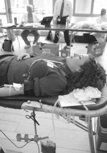 A student participates in a blood drive last month at the Yale Medical School. Largely because of a large publicity campaign, Yale topped Harvard in a blood drive last week in which the two schools competed over who could collect more blood. The drive netted 564 pints of blood between the schools.
