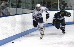 Yale men’s hockey captain Nick Shalek ’05 (6) races to the puck in a game against Dartmouth Feb. 19 at Ingalls Rink. After making the team his freshman year as a walk-on, Shalek’s work ethic and determination helped him become the team’s leader. Against Union Feb. 25, the New York native tallied his first-ever goal as a Bulldog.
