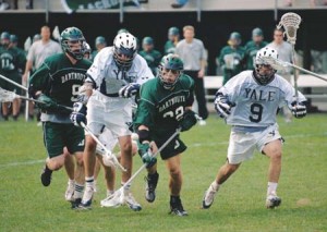 Daniel Brillman ’06 (9) looks on as a teammate tangles with a Dartmouth player April 20 at the Soccer-Lacrosse Stadium. The No. 16 Elis fell to the Big Green 15-10 in that game before being upset by the Crimson Saturday in Cambridge. The Elis never led in the loss, which will likely eliminate them from contention for an NCAA tournament berth.