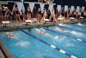 Chase Butler ’07 (far left) looks on during a freestyle relay at the Nutmeg Invitational on Dec. 4, 2005. Both the men’s and women’s teams travel to Cambridge this weekend to face Harvard and Princeton in the touted H-Y-P double-dual meet. The competition is an important measuring stick before the championship meets.