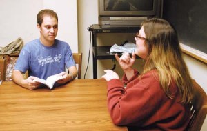 Yale’s three deaf undergraduates, including Jeffrey Zuckerman ’10, above, in class with his interpreter, use both sign language and oral communication in their classes.