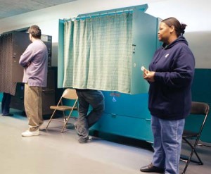 Voters file into the New Haven polls, the last stop in a journey full of obstacles. Yale students faced hurdles such as problems with registration before casting their votes.
