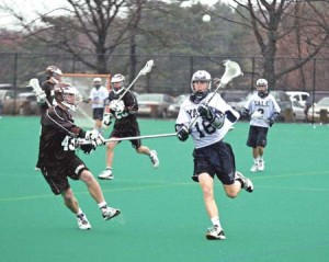 Men’s lacrosse midfielder Michael Barry ’09 flees from a defender during a 14-8 win over Brown on April 8, 2006. Last weekend, Yale overcame No. 18 UMass, 7-6.