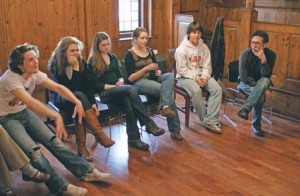 The Theater Studies class preparing for an April production of “Our Town” meets with drama school professor Christopher Bayes (R).