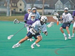 Ball in possession, attacker Tyler Casertano ’08 shoots a glance over his shoulder during a 10-4 win over Holy Cross on April 4, 2006.