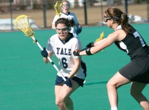 Kat Peetz ’08 drives with tight coverage from a UMass defender during last Wednesday’s win. The electric Elis stormed to a fifth straight win in Mass. yesterday.