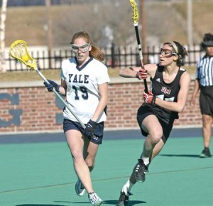 Linden Ellis ’09 has company as she charges upfield against UMass last Wednesday. The Elis go for their first win versus Princeton since 2003 on Saturday.