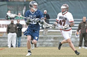 Middie Jerome Arnold ’08 looks down the field with a Brown attack in hot pursuit. The Elis battled through a back-and-forth game in Providence, but ultimately succumbed in their fourth straight Ivy loss on Saturday.
