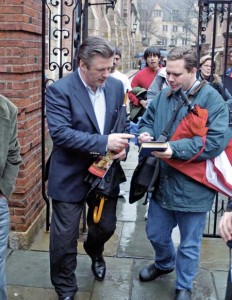 Alec Baldwin, left, signs an autograph outside PIerson College after speaking to an oversubscribed crowd of Elis.