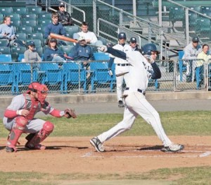 A Yale batter finishes a cut during the Elis’ doubleheader against Sacred Heart on Tuesday. The Bulldogs would go on to split the twin bill.