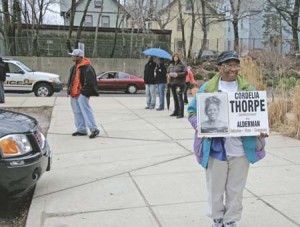 Residents demonstrate their support for Cordelia Thorpe on Election Day. Thorpe is disputing Gregory Morehead’s Ward 22 victory.