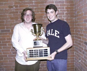 Dylan Gadek ’07, left, and David Denton ’07 pose with a debate trophy after their victory at the national debate championships.