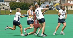 In her final regular-season game in Bulldog blue, women’s lacrosse captain Lindsay Levin ’07 gets aggressive in the middle of a fray during her team’s 13-8 romp over Cornell on Saturday. The final-game victory secured second place for the Elis.