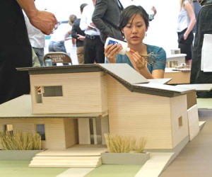 A first-year architecture student puts the finishing touches on her final Building Project model. Winners were announced last night.