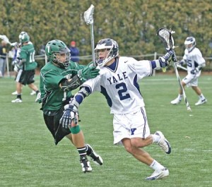 Captain and midfielder Chris Kempner ’07 shoves off a Dartmouth defender during the Bulldogs’ 15-12 win over the Big Green on April 18. The Bulldogs are coming off a 9-8 win over Harvard on Saturday.