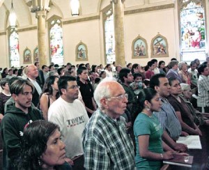 Over 1,000 supporters and residents congregated in the St. Rose of Lima Church for a mass conducted two days after the June raids.