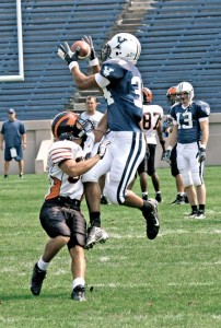 Jarren Simmons ’09 wraps his hands around a pass over the defender’s lurch at the annual Yale-Princeton scrimmage yesterday. The traditional practice at the Yale Bowl is a preview for the regular season road matchup on November 10.