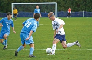 D Alex Guzinski ’09 maneuvers around blue-shirted Columbia Lions during the Bulldogs’ 4-3 overtime triumph at Reese Stadium last October.