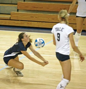 Libero Kelly Ozurovich ’11 gets low for a dig while middle Kristen Wilk ’09 looks on during the volleyball team’s 3-0 blowout over Maine on Saturday night. The Elis won all three of their Yale Invitational games.