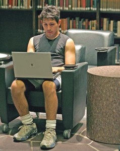 Dan Vargas ‘10 uses the wireless internet on his computer in the Morse library. The University will add wireless Internet to dorms and other facilities in the next two years