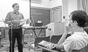 A student listens intently as professor Fred Sigworth speaks about the common ground of faith and science. In a talk on Friday, Sigworth discussed how to reconcile Christianity with scientific theory and condemned the scientism movement.