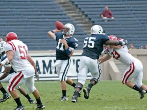 Quarterback Matt Polhemus ’08 uncorks a pass behind tight coverage from tackle Darius Dale ’09 during yesterday’s historic rout of Cornell at the Yale Bowl.