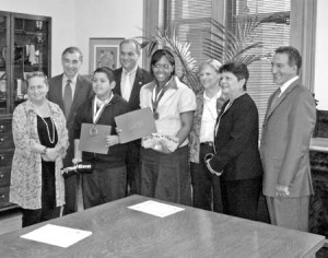 Two New Haven students who were honored as the city’s first Carson Scholars stand with Mayor DeStefano. The scholarships will now be awarded at the students’ schools yearly.