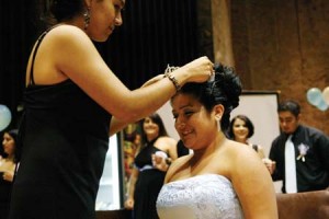 Angelina Calderon ’10 receives a tiara as part of the mock quinceanera, a ritual representing a girl’s passage to womanhood.