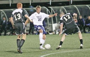 Forward Kevin Pope ‘10 moves past Army defenders. The Elis beat Army 1-0 but were unable to carry the momentum into their game against Cornell.