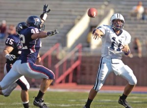 Quarterback Matt Polhemus ’08 passes the ball in the second overtime against the Quakers. Yale defeated Penn 26-20 in triple overtime.