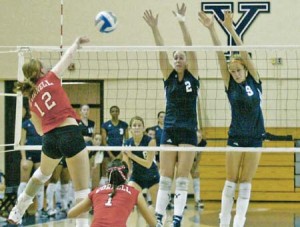 Outside hitters Kali Nelson ’08 and Kristen Wilk ’09 go up to block a shot against Cornell on Friday. The Elis had 14 team blocks in the 3-1 win.