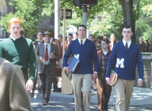 Extras on the set of “The Adventures of Young Indiana Jones” stroll across campus. With students gone, University buildings lent themselves to film crews this summer.