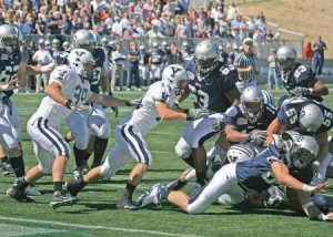Linebacker Jay Pilkerton (39) and defensive back Steve Santoro (14) close in on a Georgetown ballcarrier during the team’s season opener Sept. 15. Both defensive starters were injured this weekend at Penn. The Bulldogs will spend the week with lighter practices to speed recovery after Saturday’s three-overtime game.