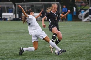 Sophia Merrifield ’10 tackles Brown midfielder Kate Scott during the Bulldogs’ 3-1 victory Sunday. The win puts Yale alone in second place.