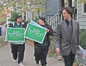 Green Party mayoral candidate Ralph Ferrucci posts signs during a door-to-door campaign for Elm City votes. He publicly criticized the long-standing incumbent, John DeStefano Jr.