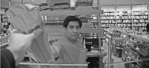 Atticus employee Javier Perez hands out free Chabaso bread to voters who wear an “I Voted” sticker.