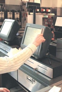 A student swipes at a dining hall terminal. Since the prohibition of “double swiping,” University Dining Services retains more student meal dollars.