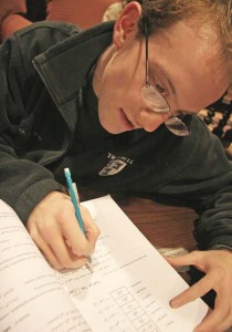 Dan Bleiberg ’09 completes homework. Addition of sections and a search for another lector are the result of record-high course enrollment.