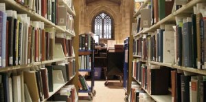 Books requested by patrons are shelved behind the circulation desk of Sterling Memorial Library. Many could be available online in the next year.