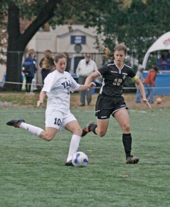 Maggie Westfal ’09 prepares to pass against Brown on Nov. 3. That win, coupled with this week’s, cemented the Elis in second place.
