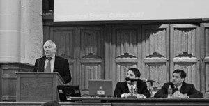 The Energy Information Administration’s Guy Caruso speaks Friday. Fluctuating oil prices make energy predictions difficult to construct, he said.