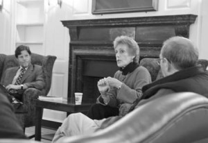Ellen Bravo speaks with Davenport College Master Richard Schottenfeld yesterday. Bravo said workplace policies make professional life harder for women with families.