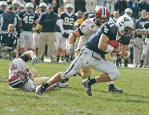 Quarterback Matt Polhemus ’08 lunges for an extra yard during the Crimson’s 37-6 trouncing of the Elis at the Yale Bowl on Nov. 17.